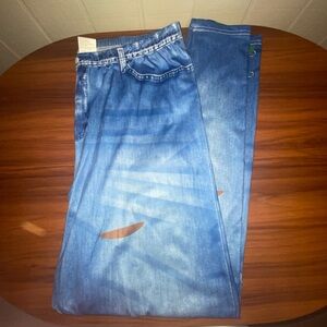 Blue denim pants with color lace designs.
